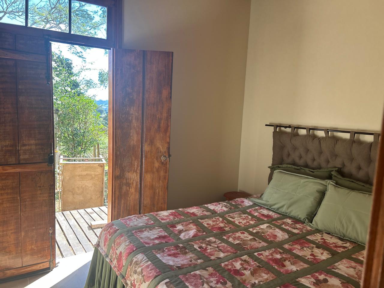 Suíte com varanda e vista